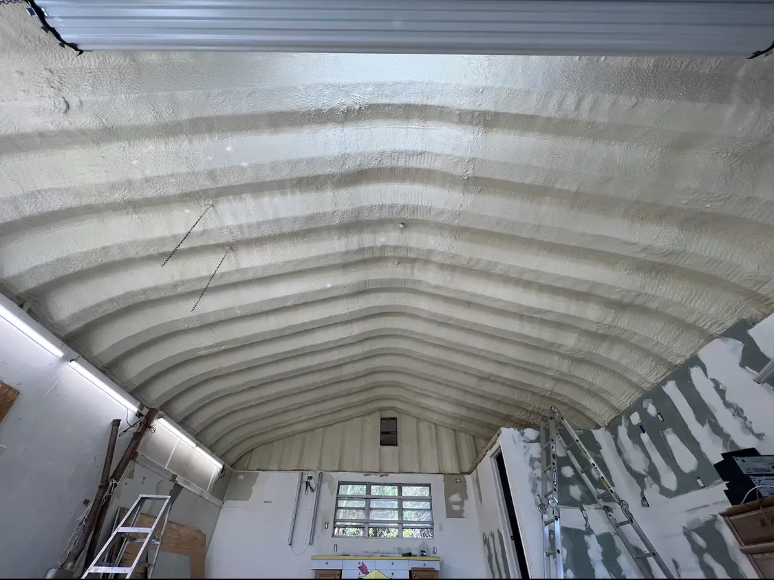 Spray polyurethane foam applied to the underside of a metal roof deck in Eastpointe